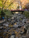 Minoo waterfall with red bridge in autumn at Minoo nati Royalty Free Stock Photo