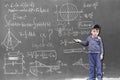Minor child at the blackboard writing formulas