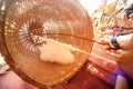 Minority elder woman spinning cotton with a spinning wheel. Royalty Free Stock Photo