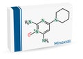 Minoxidil molecule. It is an antihypertensive vasodilator medication, is used to treat hair loss. Paper packaging for drugs