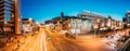 Minsk, Belarus. Panorama Evening Night Traffic Near Cathedral of Saints Peter and Paul and Bas-relief of the Soviet era Royalty Free Stock Photo