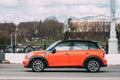 Minsk, Belarus. Orange Color Mini Cooper All 4 Car In Motion On Street