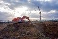 Tracked excavator KRANEKS working at a construction site. Construction machinery for excavating,
