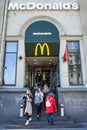 Minsk, Belarus, April 4, 2018: Visitors enter and exit from the McDonald`s restaurant.