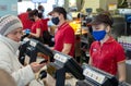 MINSK, BELARUS - April 27, 2020: Workers in medical masks serve customers at McDonald`s restaurant during a Coronavirus epidemic.