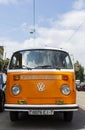 Minsk, Belarus, August 14 2018 - Orange and white Volkswagen Type 2 VW T2 parked on the street, known as the Transporter Royalty Free Stock Photo