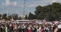MINSK, BELARUS - AUGUST 16, 2020: People Carry Giant White-red-white Historical Flag Down The Street. Belarusians Took