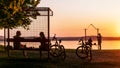 People enjoy the view of the lake surface in the evening Royalty Free Stock Photo