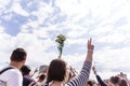 Minsk, Belarus - August 15, 2020. Protest actions in Minsk. Woman with hands raised up. In one hand she holds flowers and in the