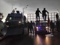 Minsk / Belarus - August 30 2020: Riot police blocking the road for protesters with water cannons, cages and shields