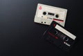 MINSK BELARUS-06/29/2020: Compact cassettes TDK D-C90, BASF Audio on a black background. Old white and black vintage audio cassett Royalty Free Stock Photo