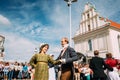 Minsk, Belarus. Couple of people dressed in clothes of the 19th