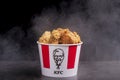 Minsk, Belarus - December 03, 2021: black background, night. Lots of hot wings or strips of KFC chicken in a KFC Kentucky Fried Royalty Free Stock Photo