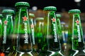 MINSK, BELARUS - December 13, 2019: Bottles of Heineken beer in refrigerator of supermarket close up.