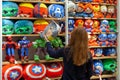 MINSK, BELARUS - December 20, 2019: Buyer chooses toys superheroes of Marvel universe made by Miniso.