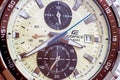 Modern stylish brown men Casio Edifice hand watch face close up.