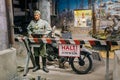 Statue of a German soldier from the gendarmerie Feldgendarmerie stands guard behind a barrier In The Belarusian Museum