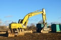 Excavator New Holland E215B with crusher bucket MB BF80.3 S4 for crushing concrete at construction site