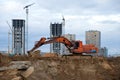 Excavator KRANEKS EK 270LC working at construction site. Construction machinery for excavating,