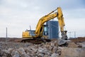 Excavator NEW HOLLAND with jaw crusher bucket for crushes concrete and recycle material. MB Crusher