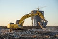 Excavator NEW HOLLAND with jaw crusher bucket for crushes concrete and recycle material. MB Crusher