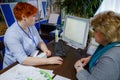 MINSK, BELARUS - FEBRUAR 1, 2018: Doctor taking care of suffering senior patient