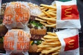 MINSK, BELARUS - February 18, 2018: Burgers and french fries on tray in McDonald`s Restaurant. Top view.