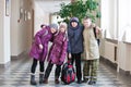 Four school kids pose for a photograph at school