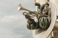 Statue of clowns musicians with a horn and a trumpet`