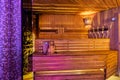 Minsk, Belarus, 03.03.2019: Interior of wooden finnish sauna with birch broom, bucket and stove. The Finnish sauna is a