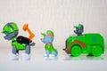 Minsk, Belarus - January 9, 2022: Paw patrol team. Different miniatures of hero Rocky with green recycle truck