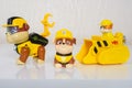 Minsk, Belarus - January 9, 2022: Paw patrol team. Different miniatures of hero Rubble with yellow bulldozer