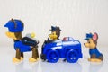 Minsk, Belarus - January 9, 2022: Paw patrol team. Miniatures of hero Chase with blue police truck