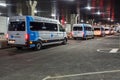 MINSK, BELARUS - JANUARY 2020: rows of new white minibuses and vans on parking