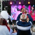 Elderly man applauds at opposition rally in Minsk on July 30, 2020. Belarusian politic opposition. Presidential Elections in Belar