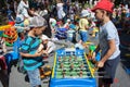 Minsk, Belarus, June 3, 2018: Children play table football on playground with a lot of children, parents and toys in city outdoors