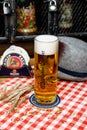 Minsk, Belarus - June 17, 2020: a glass of Hacker-Pschorr, German beer brewed since 1417.