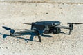 Minsk, Belarus, June 1, 2022: New drone DJI mavic 3 is standing on a concrete surface. Parts of a new modern quadcopter in close-
