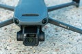 Minsk, Belarus, June 1, 2022: New drone DJI mavic 3 is standing on a concrete surface. Parts of a new modern quadcopter in close-