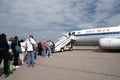 Minsk, Belarus - June 5, 2021: People board a Belarusian plane Royalty Free Stock Photo