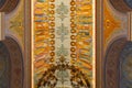 Minsk, Belarus - June, 2019. Pictured ceiling in the Church of All Saints with images of all saints in yellow light
