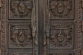 Minsk, Belarus - June 2019. Wooden door with engraving of memorials of Chernobyl nuclear explosion and concentration