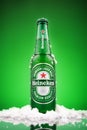 MINSK, BELARUS - MARCH 13, 2019: Cold bottle of Heineken Lager Beer over green background. Heineken is the flagship Royalty Free Stock Photo