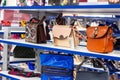 MINSK, BELARUS - MARCH 22, 2021: New woman leather handbags on the clothes retail store shelf.