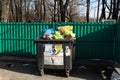 Minsk. Belarus. March 9, 2019. outdoors. tank with a lot of trash. there are birds. not sorted