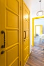MINSK, BELARUS - March, 2019: retro bright interior of hipster flat apartments with yellow door Royalty Free Stock Photo
