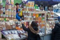 MINSK, BELARUS - March 20, 2020: Sale of different sweets, nuts and dry fruits on market. A woman buys nuts at market.