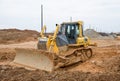 Track-type bulldozer KOMATSU D65EX at construction site