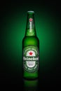 Minsk, Belarus - May 10, 2020 : Bottle of Heineken Lager Beer on green background Royalty Free Stock Photo