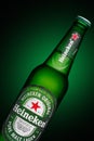 Minsk, Belarus - May 10, 2020 : Bottle of Heineken Lager Beer on green background Royalty Free Stock Photo